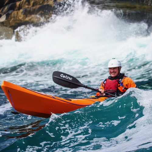 Kayaker in rough sea